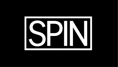 White uppercase letters spelling SPIN inside a white rectangular border on a black background.